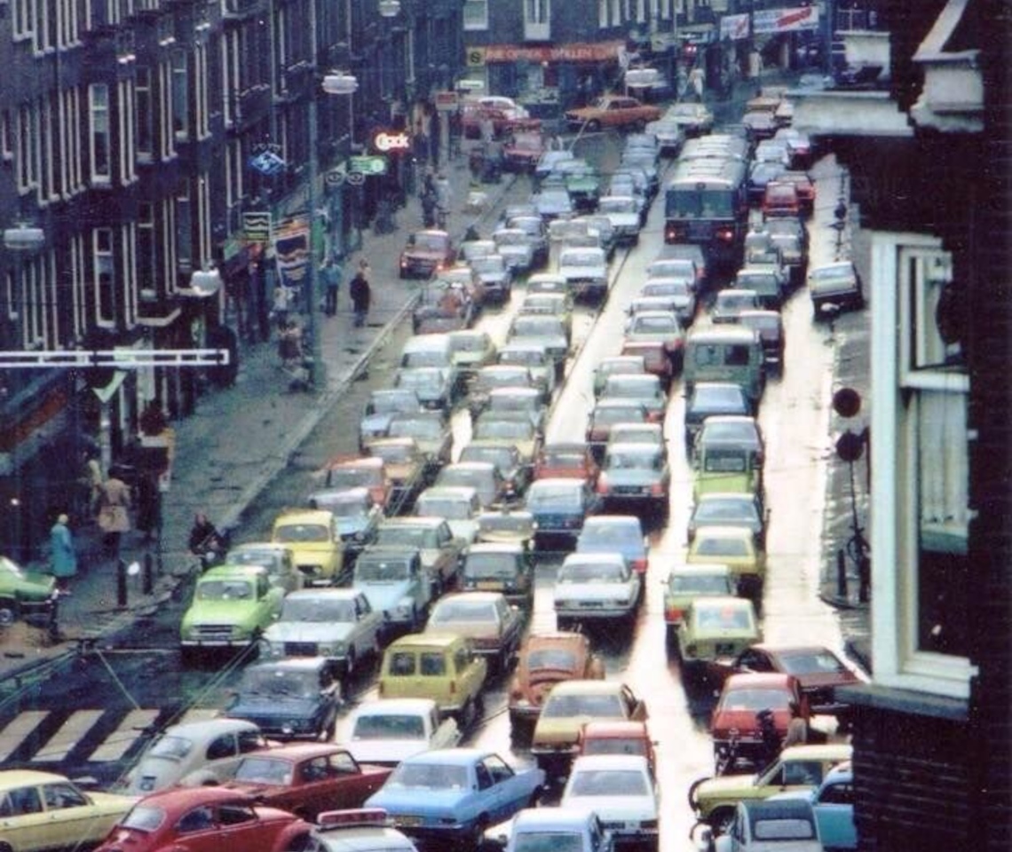 City street with bumper-to-bumper traffic congestion across five lanes